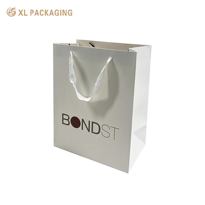 Borsa di carta personalizzata professionale Bianco bordo Bianco Uno per lo shopping Abbigliamento Calzature Imballaggio Borsa da shopping con logo