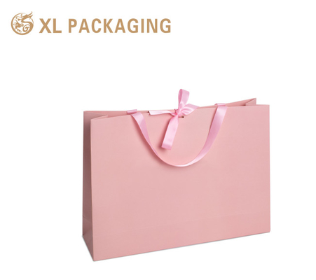 Borsa regalo in carta di lusso rosa boutique borse di imballaggio in cartone 250G GSM con manico di stampa del proprio logo
