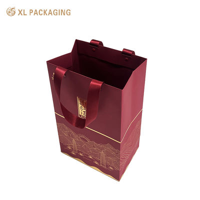 Borsa regalo di lusso eco-friendly premium con timbro in foglio d'oro e maniglie a nastro rinforzato per imballaggi personalizzati